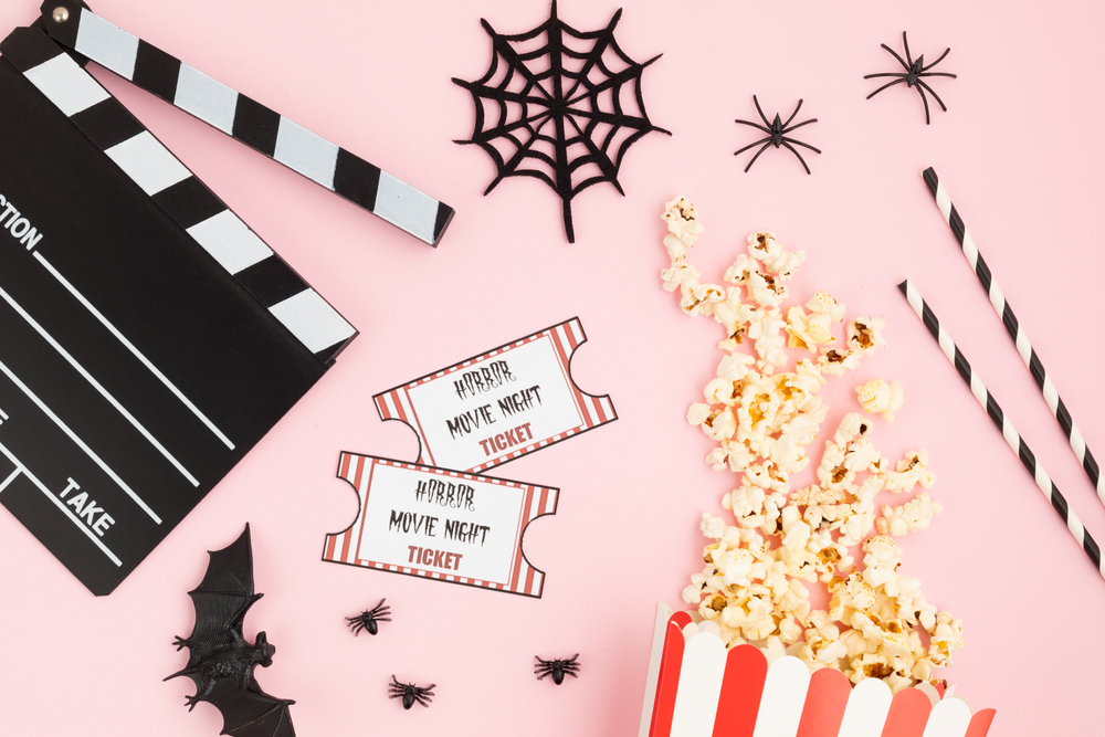 Movie,Clapperboard,And,Halloween,Decoration,Over,Pink,Background.,Horror,Movie